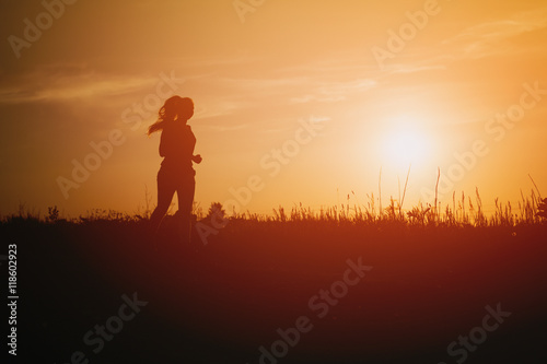 teenage girl runner countryside in sunset