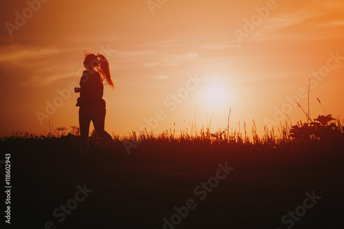 teenage girl runner countryside in sunset