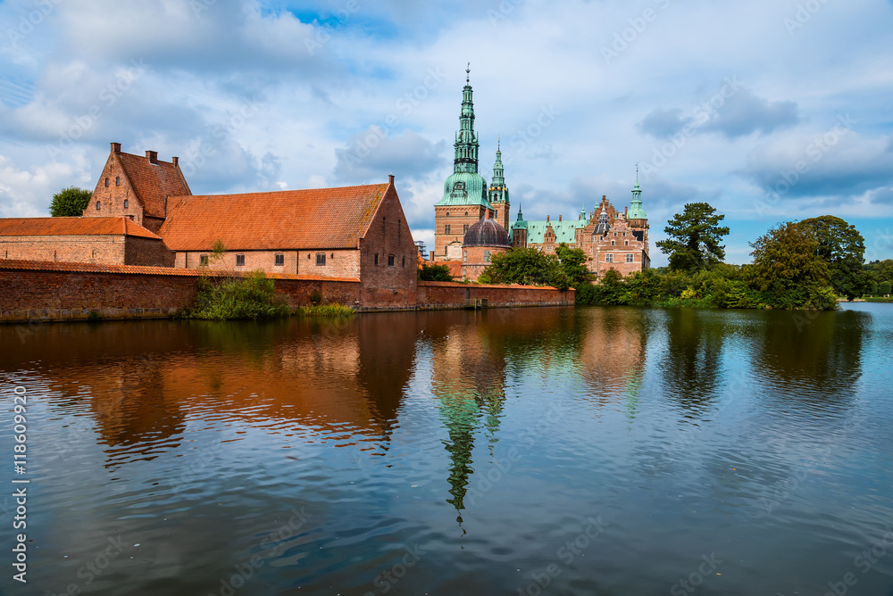 Frederiksborg castle reflected in the lake in Hillerod, Denmark. Renaissance castle and romantic lake near Copenhagen. Frederiksborg castle reflected in the lake in Hillerod, Denmark. Renaissance castle and romantic lake near Copenhagen.
