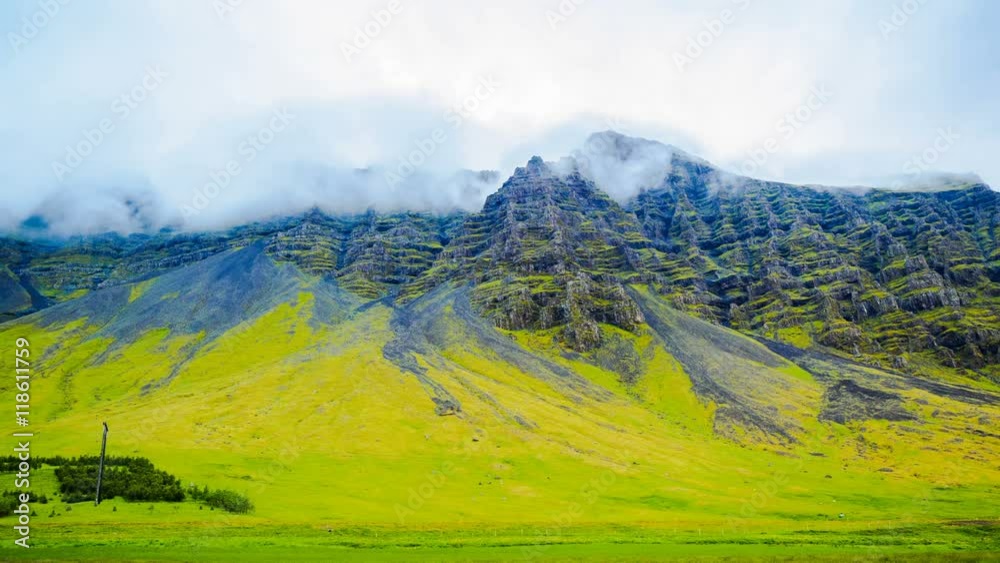 Time lapse of rain clouds flow over the mountain in Iceland 4K Ultrahd