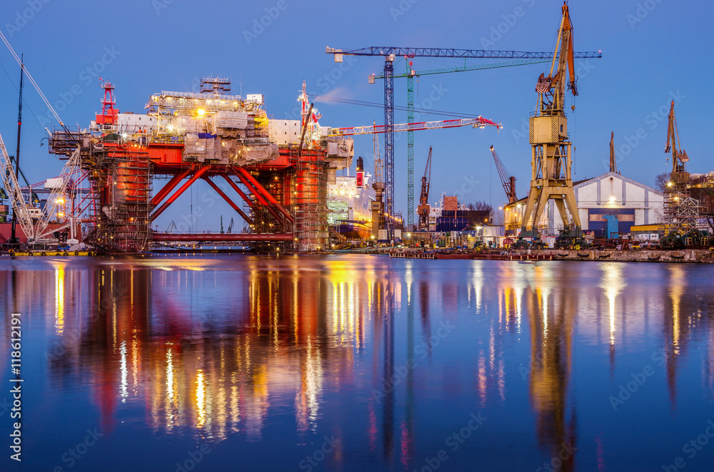 The oil platform under construction in the shipyard at night. Gdansk. Poland.
