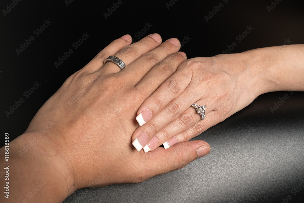 Hand of the groom and the bride with wedding rings
Hand of the groom and the bride with wedding rings