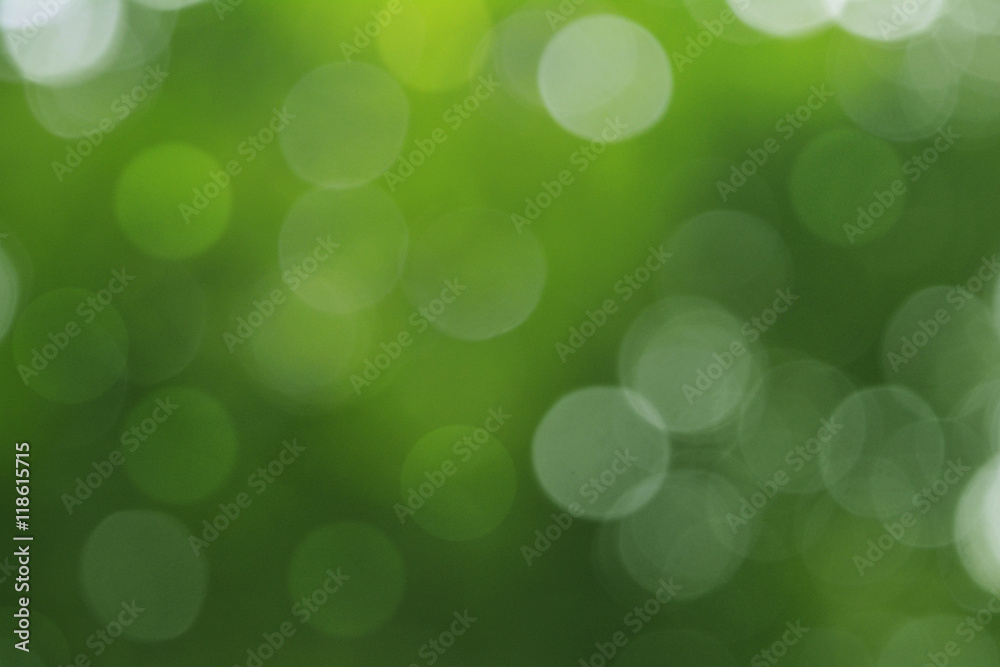 Obraz premium Abstract circular green bokeh background.