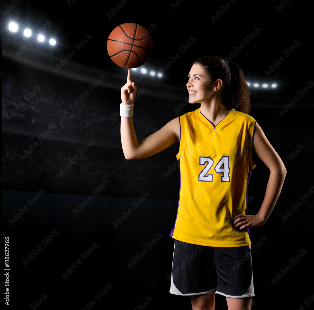 Naklejka premium Young girl basketball player