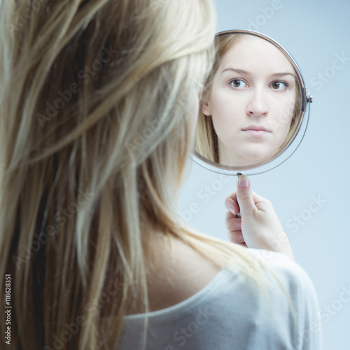 Looking in mirror