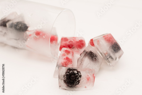 Ice Cubes with frozen Berries photo