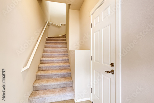 Hallway interior. View of carpet stairs.