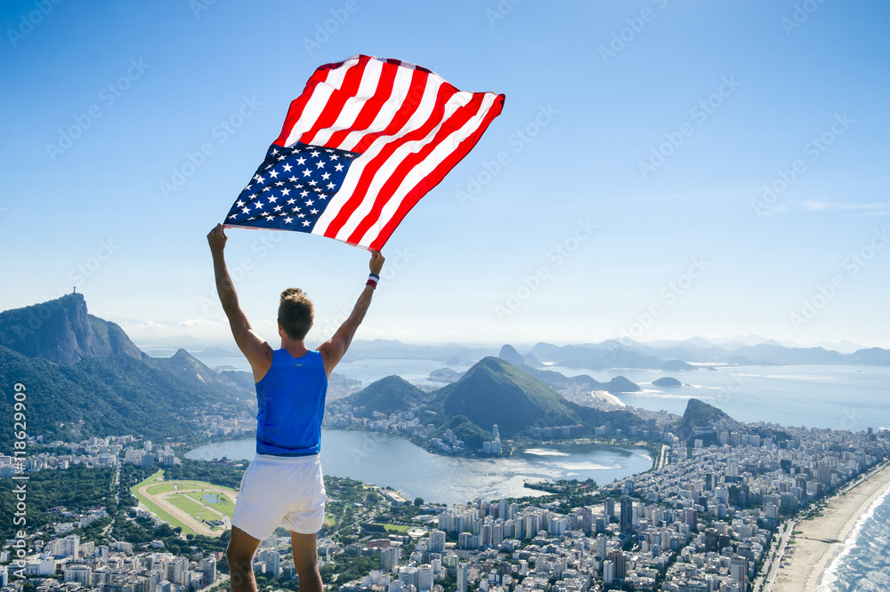 Athlete Stands Holding An American Flag At A Bright Overlook Of The City Skyline Of Rio De Janeiro Brazil Stock Photo Adobe Stock