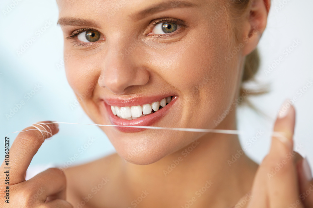 Dental Hygiene. Beautiful Woman Flossing Healthy White Teeth. High Resolution Image Dental Hygiene. Beautiful Woman Flossing Healthy White Teeth. High Resolution Image