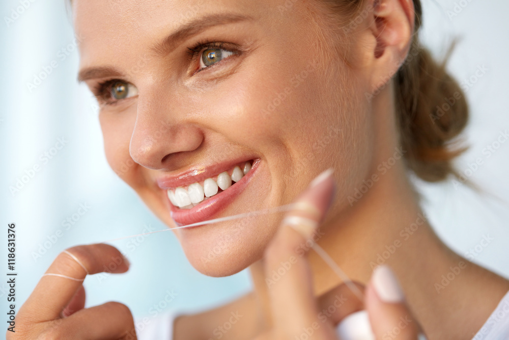 Dental Hygiene. Beautiful Woman Flossing Healthy White Teeth. High Resolution Image Dental Hygiene. Beautiful Woman Flossing Healthy White Teeth. High Resolution Image