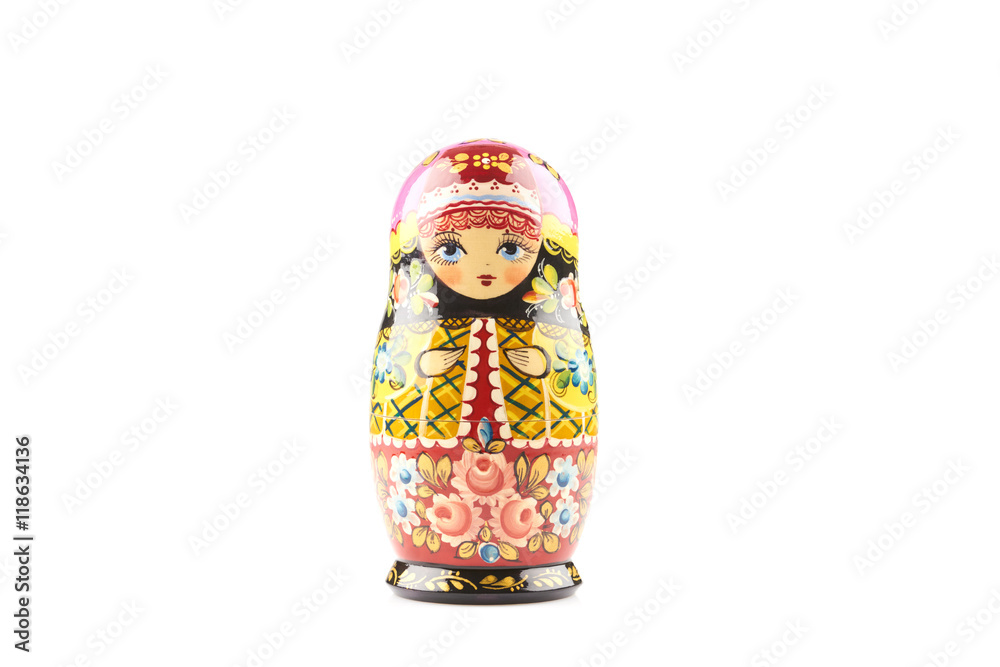 Wooden matryoshka doll painted in russian traditional style ornaments on white isolated background Wooden matryoshka doll painted in russian traditional style ornaments on white isolated background