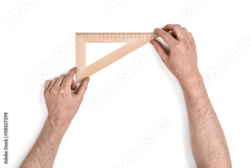 Man holding a wooden set square