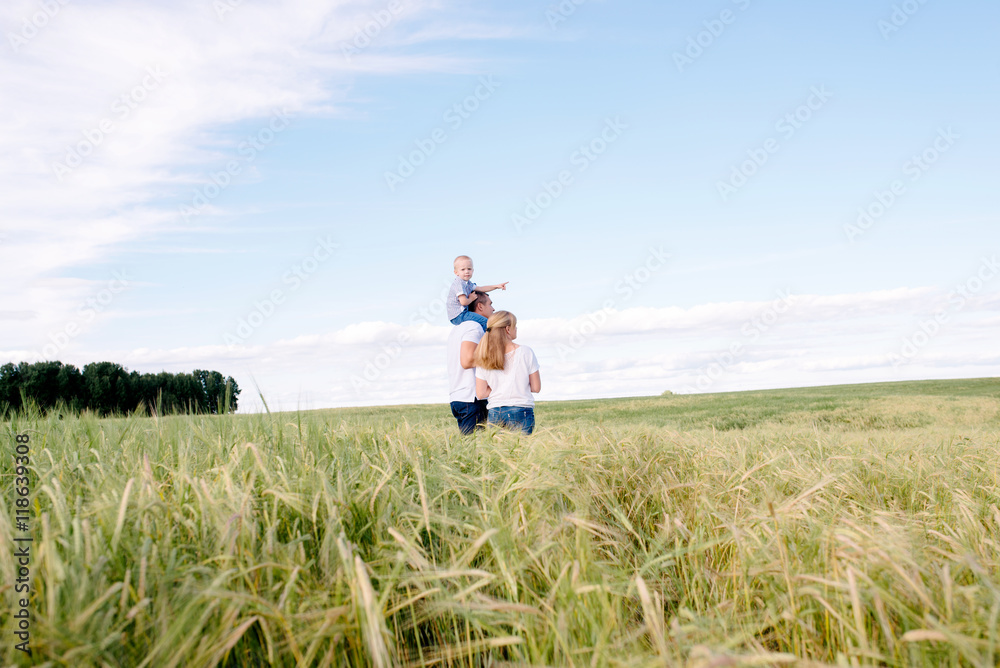 the happy family walks across the field the happy family walks across the field