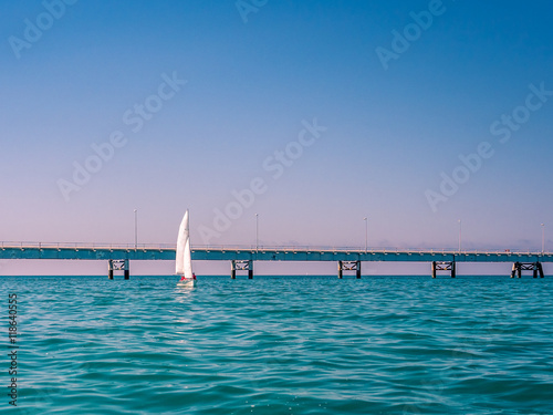 Sailboat on a quiet sea in summer in Italy