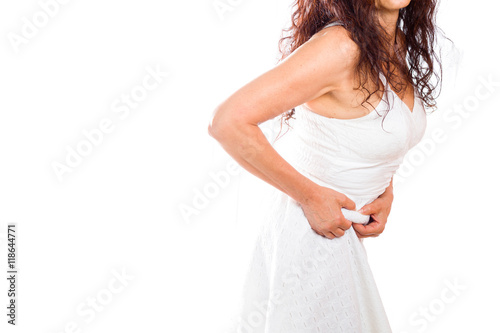 mature woman pinching love handles