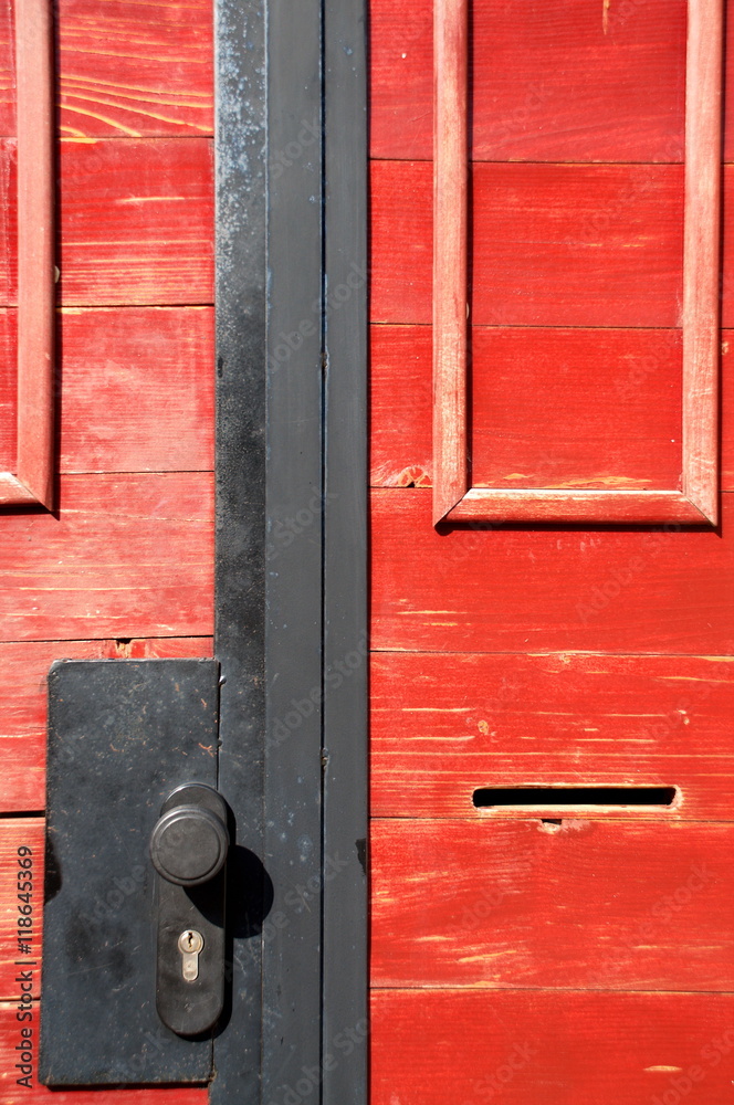 Part of old red wooden door with keyhole Part of old red wooden door with keyhole