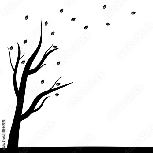 Silhouette of a tree and autumn leaves