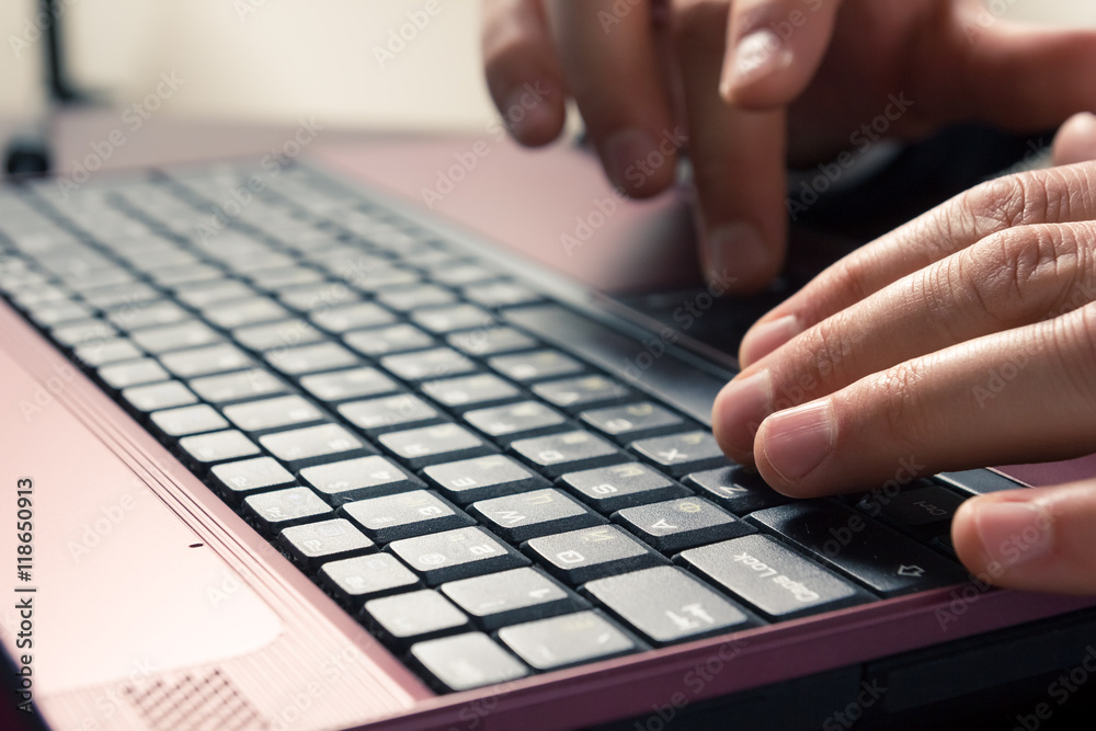 Businessman hands typing on a computer keyboard Businessman hands typing on a computer keyboard
