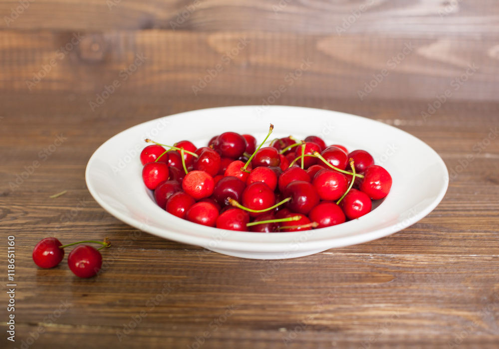 Fresh cherries in the white plate Fresh cherries in the white plate