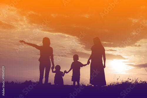 Happy family dancing on the road in the sunset time. Evening par © stcom