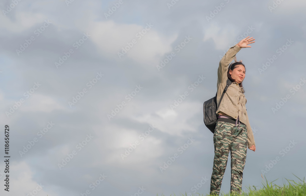 Carefree woman having a good time at the meadow