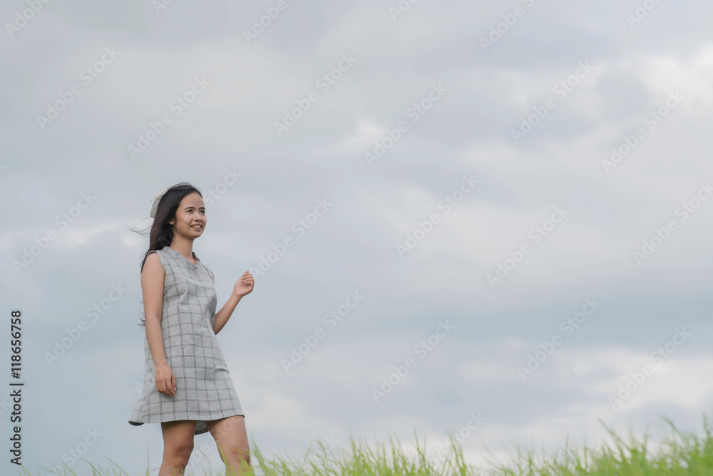 Carefree woman having a good time at the meadow Carefree woman having a good time at the meadow