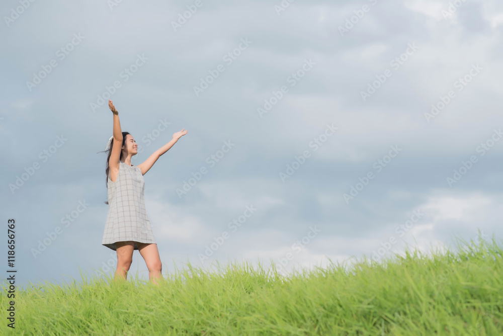 Carefree woman having a good time at the meadow Carefree woman having a good time at the meadow