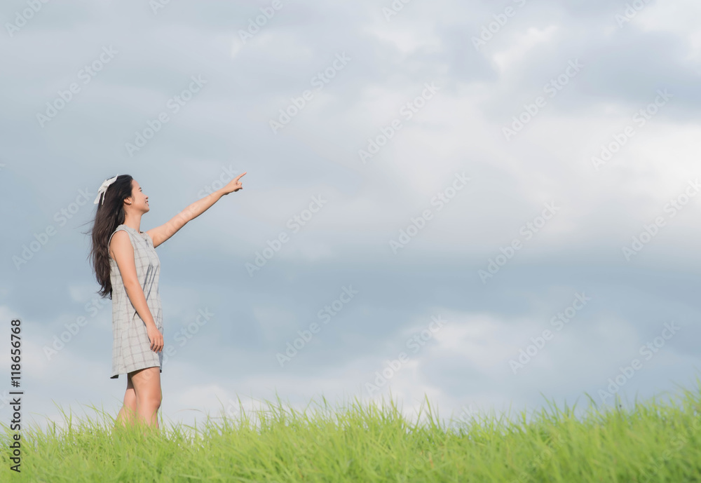 Carefree woman having a good time at the meadow Carefree woman having a good time at the meadow
