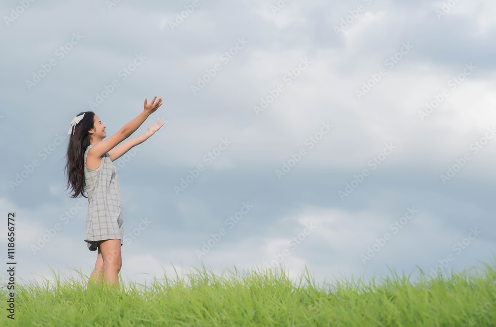 Carefree woman having a good time at the meadow Carefree woman having a good time at the meadow