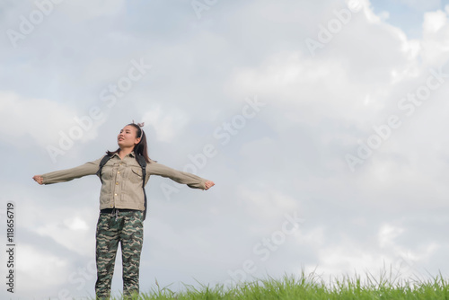 Carefree woman having a good time at the meadow