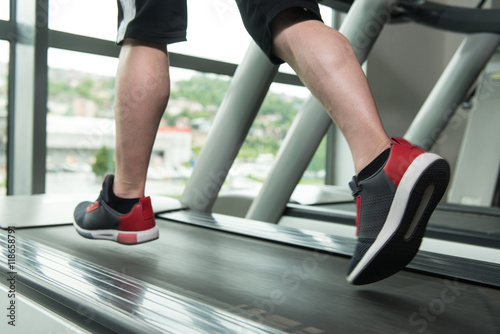 Close-Up Man Feet On Treadmill
