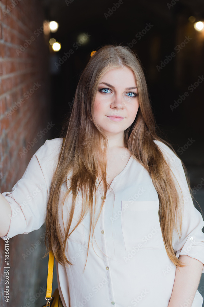 blonde into hallway of a brick wall cafe blonde into hallway of a brick wall cafe