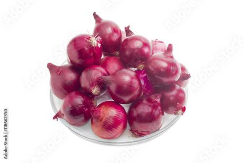 Pile of red onion on a glass dish