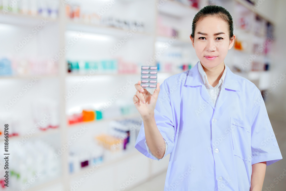 Pharmacist and Doctor woman holding pill in hand , health care a
