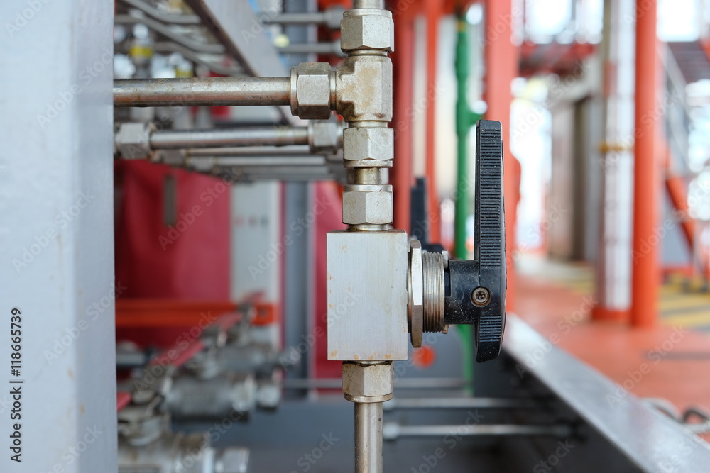 Manual valve in oil and gas industry, old valve and many rust present on the valve, Equipment for control production process. Manual valve in oil and gas industry, old valve and many rust present on the valve, Equipment for control production process.