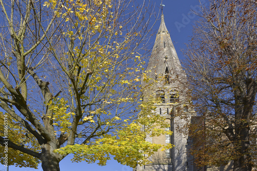 Принти на полотні Church of Saint-Denys-Sainte-Foy with trees in autumn leaf at Coulommiers, a com