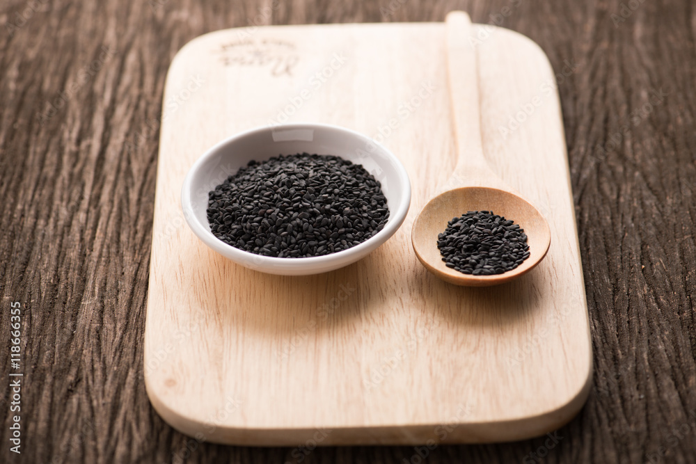 black Sesame close up shot on wood background black Sesame close up shot on wood background