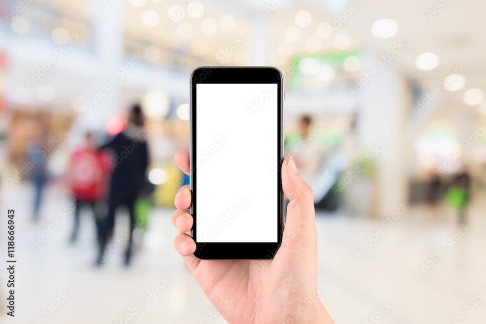 Smart phone with white screen in hand on blurred in shopping mal