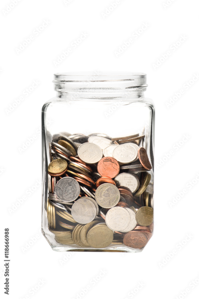 Investment growth concept,Golden coins in clear jar over white b Investment growth concept,Golden coins in clear jar over white b