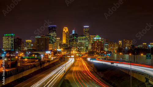 Light  streaks under the Minneapolis skyline photo