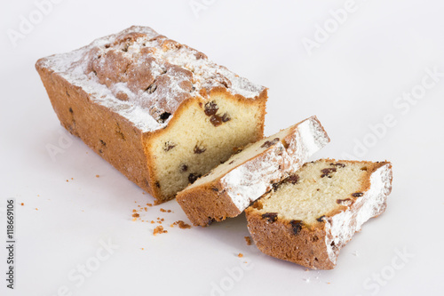 cupcake sliced with raisins on white background