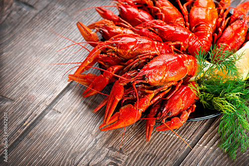 Crayfish. Red boiled crawfish on a wooden table in rustic style