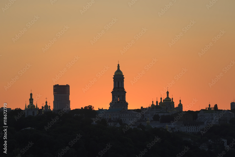Kyiv pechersk lavra with golden cupola at sunset
