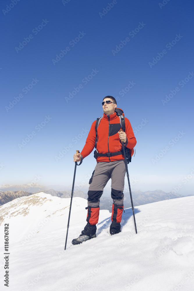 Winter hiking in the mountains with a backpack.