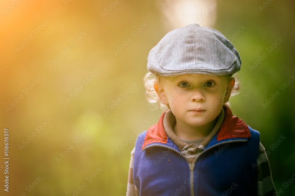 Little caucasian boy playing outdoor in summer. Little caucasian boy playing outdoor in summer.
