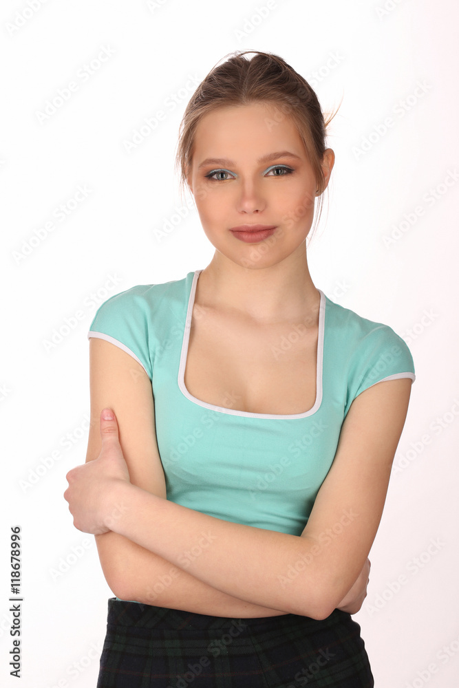 Girl with makeup and crossed arms. Close up. White background Girl with makeup and crossed arms. Close up. White background