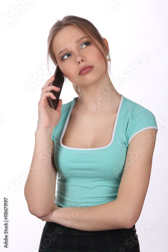 Girl talking on the phone. Close up. White background