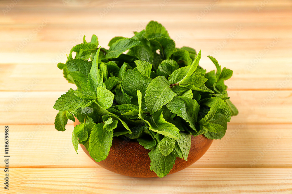 Bunch of green mint on wooden background Bunch of green mint on wooden background