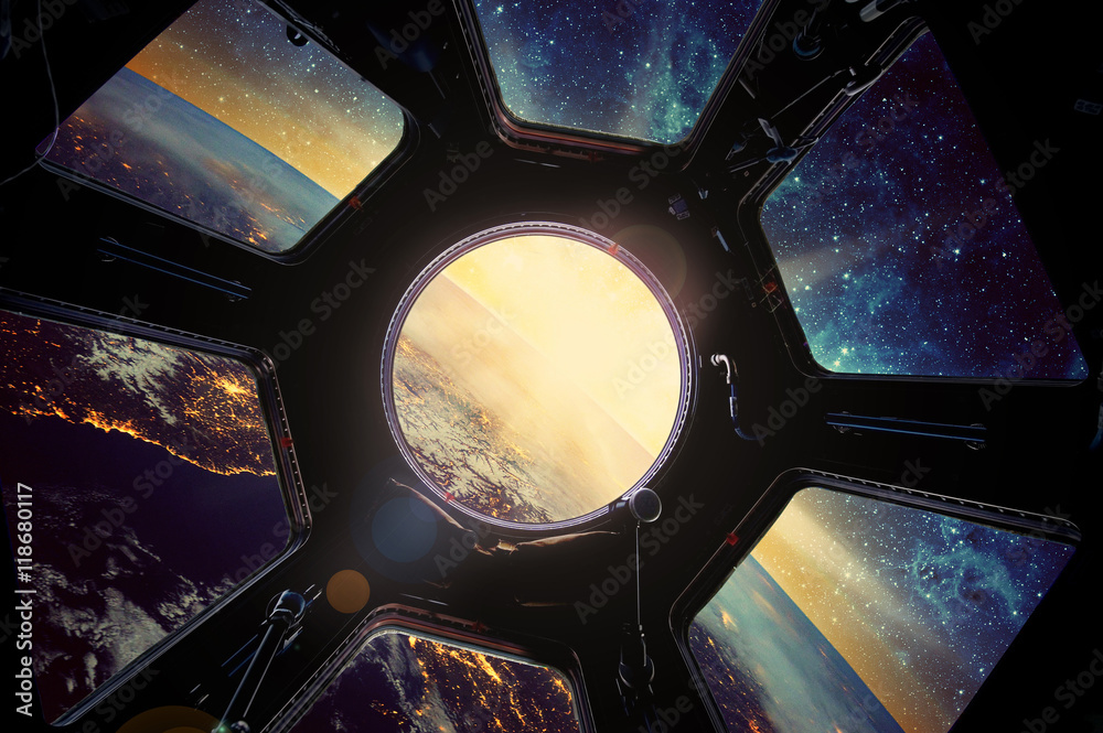 Fototapeta Earth and galaxy in spaceship window porthole. Elements of this image furnished by NASA.