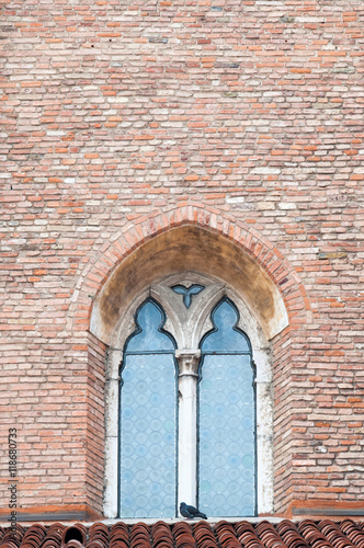Pointed window at one side of the gothic cathedral Santa Maria Annunciata in Vicenza